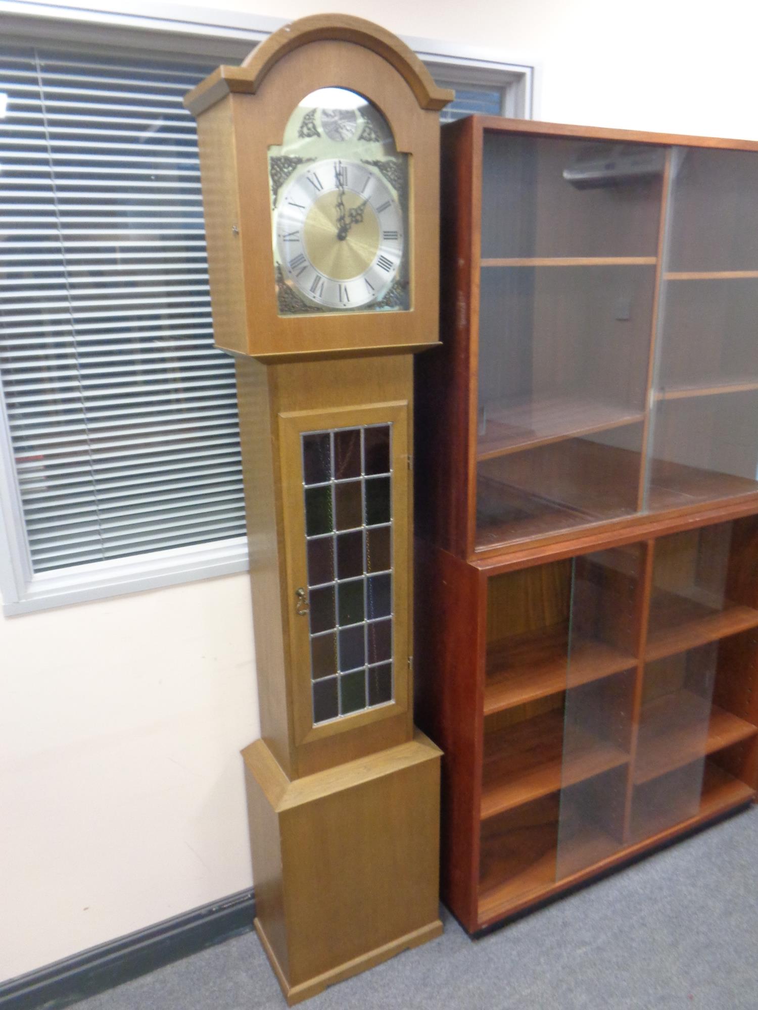 A contemporary Tempus Fugit longcase clock (no pendulum or weights)