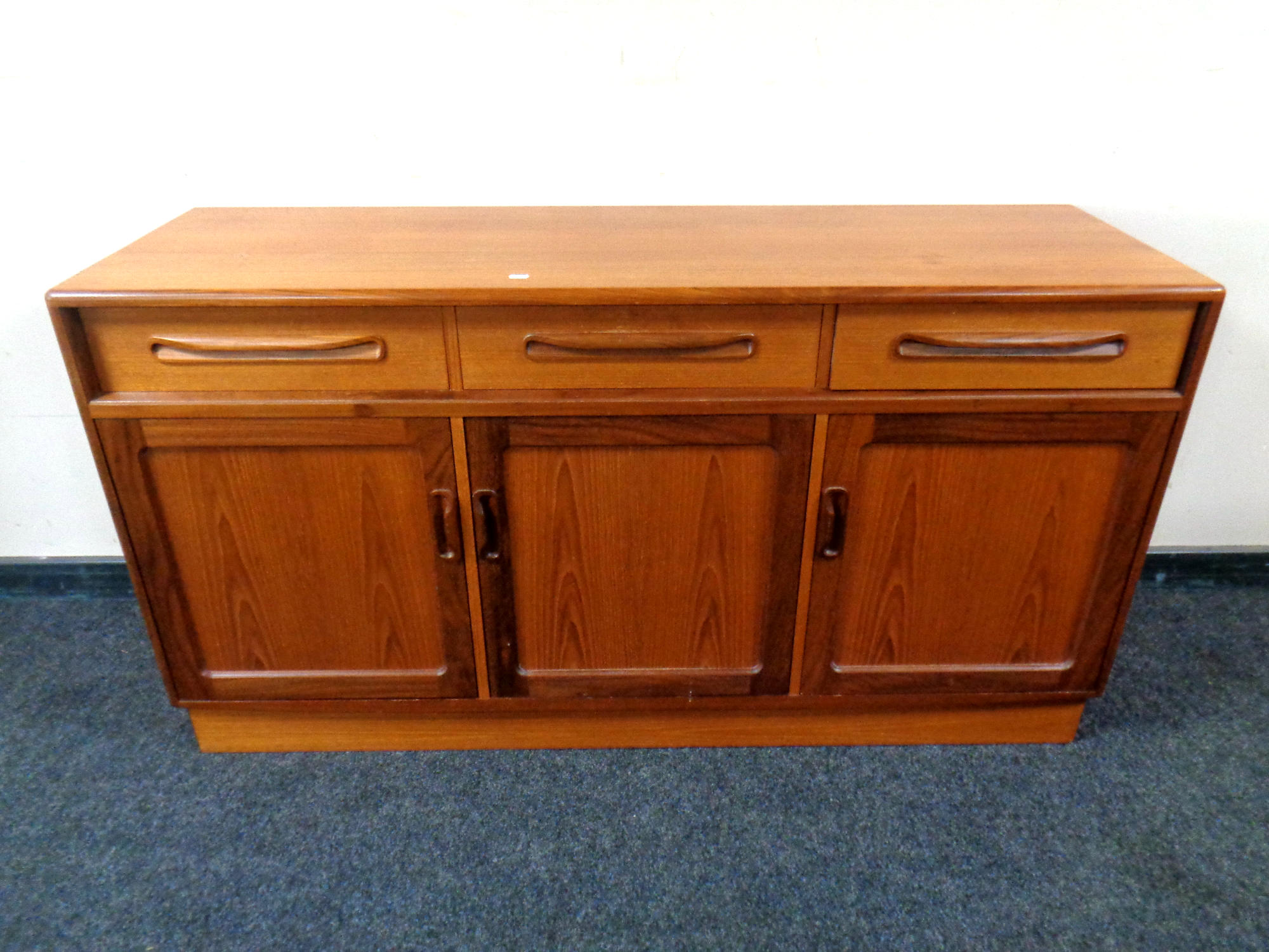 A 20th century teak low sideboard