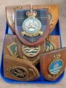 A tray of 18 military wooden plaques bearing crests