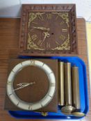 Two 20th century continental wall clocks with weights and pendulums