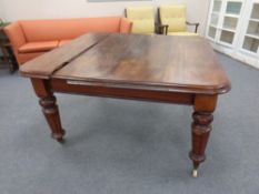 A Victorian mahogany wind out dining table (as found)