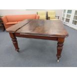 A Victorian mahogany wind out dining table (as found)