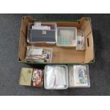 A box containing a large quantity of 20th century world stamps and a vintage Players Navy Cut tin