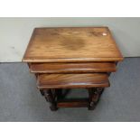 A nest of three oak tables