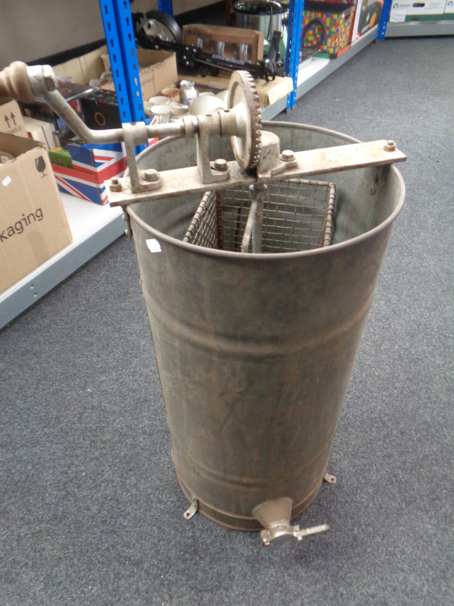 A vintage galvanized metal juicer