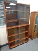 Two 20th century continental teak sliding glass door book cases