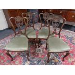 A set of four late Victorian dining chairs