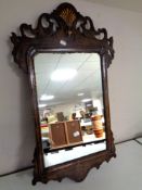 A George I style walnut and gilt mirror bearing carved date 1716 to reverse