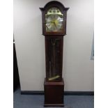 A contemporary Tempus Fugit longcase clock with pendulum and weights