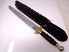 A hand-made recreation of a seax-type knife, with wire-bound ceramic grip, brass crossguard, 27.