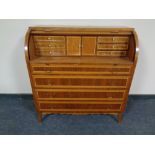 A continental beech cylinder front writing bureau