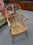 An early 20th century oak spindle back kitchen chair