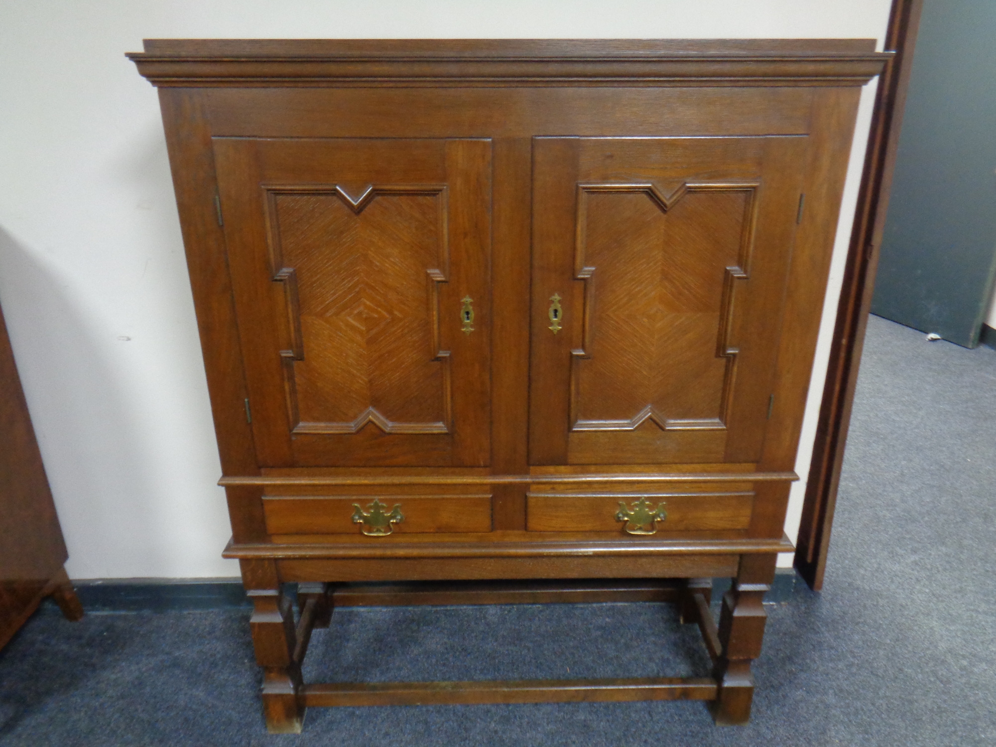 A continental oak two door cabinet