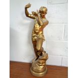 An antique gilt spelter lamp in the form of a man (height 78cm)