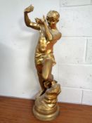 An antique gilt spelter lamp in the form of a man (height 78cm)