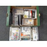 A box containing a large quantity of 20th century world stamps and Royal Mail postcards