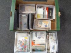 A box containing a large quantity of 20th century world stamps and Royal Mail postcards