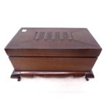A wooden trinket box on cabriole legs