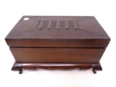 A wooden trinket box on cabriole legs