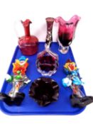A tray containing assorted glassware including an antique cranberry glass jug,