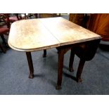 An Edwardian oak gateleg table