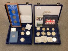 A collection of coins to include examples of silver proof coins, commemorative crowns,