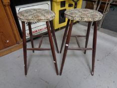 A pair of 20th century stained beech tapestry upholstered stools.