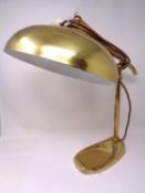 A brass desk lamp.