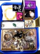 A tray containing a quantity of assorted costume jewellery and wristwatches.