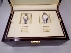 An Aston Gerard lady's and gent's wristwatch in a fitted lacquered jewellery box with outer