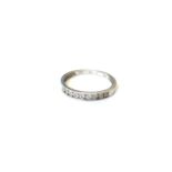 A 9ct white gold diamond half eternity ring, size O CONDITION REPORT: 1.