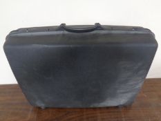 A Samsonite hard shell luggage case.
