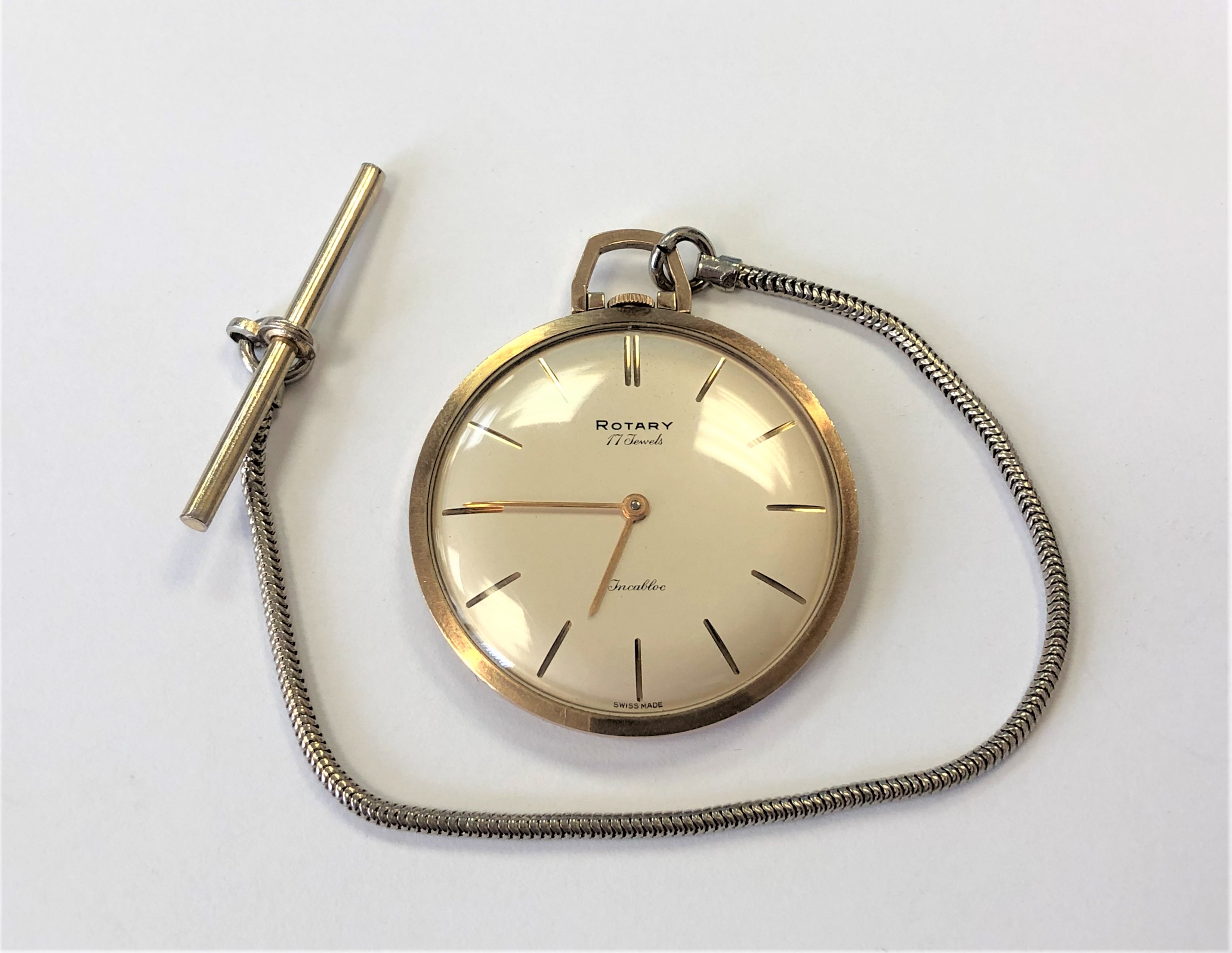 A 9ct gold Rotary fob watch on base metal Albert chain CONDITION REPORT: Watch 30g.