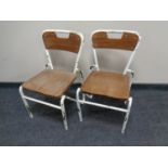 A pair of mid-20th century metal framed child's chairs.