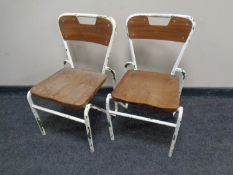 A pair of mid-20th century metal framed child's chairs.