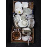 Three boxes containing a large quantity of assorted dinnerware, Pyrex dishes,