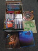 A box containing a quantity of various CDs and Vinyl LPs.
