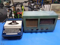 A Rees Mace marine valve radio together with a cased Remington typewriter.