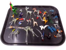 A tray containing a quantity of glass animal ornaments.