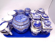 A tray containing assorted Ringtons caddies, teapots, mugs and teacups.
