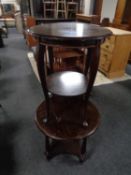 Two circular continental two tier occasional tables.