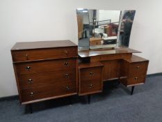 A mid 20th century teak Beautility furniture dressing table with triple mirror and matching four