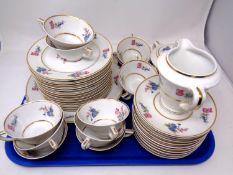 A 39 piece Limoges floral patterned, gilt rimmed tea service.