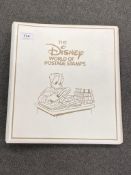 A Disney World postage stamp album issued by Westminster