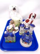 A tray containing ceramics including Staffordshire dogs, money box,