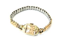 A lady's 14ct gold cased Ancre wristwatch on gilt expanding strap