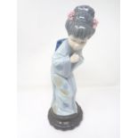 A Lladro figure - Bowing geisha.