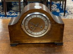 An early 20th century oak mantel clock