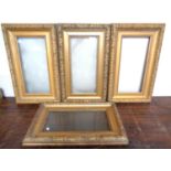 A set of four antique gilt picture frames. 63cm by 38cm.