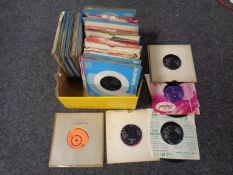 A box containing vinyl 7 inch singles including Dean Martin, Connie Francis, Paul Anka etc.